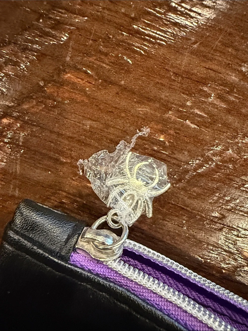 ipsy Black Satin Cosmetic Pouch with Purple Zipper and spider web on back